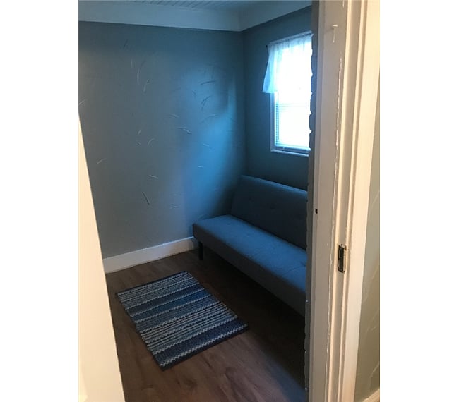 Laundry room also features a futon bed if you have friends of family visit.