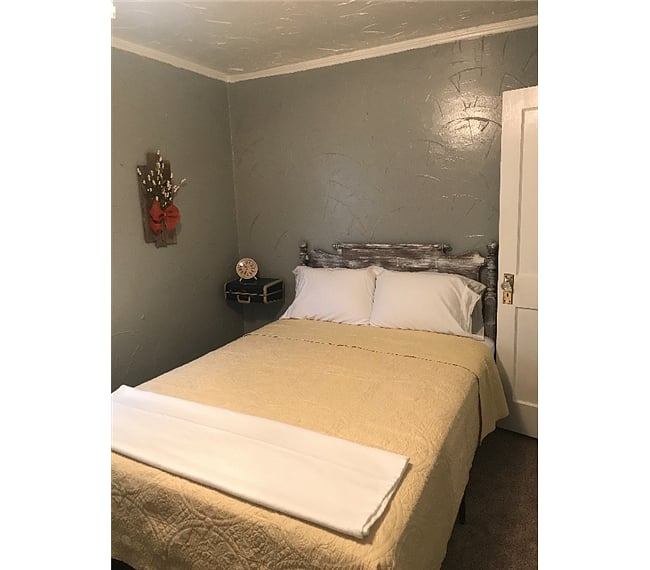 Room has queen sized bed.