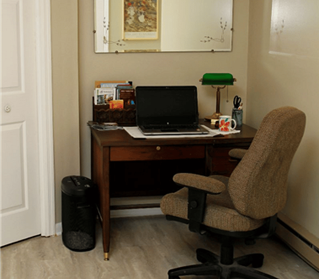 Desk Area with paper shredder & a few office supplies