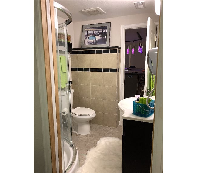 Bathroom with blowdryer on wall