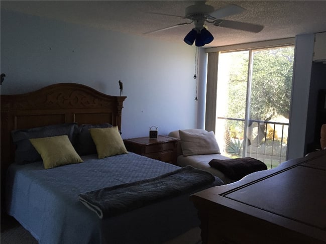 large master bedroom with queen bed and day bed