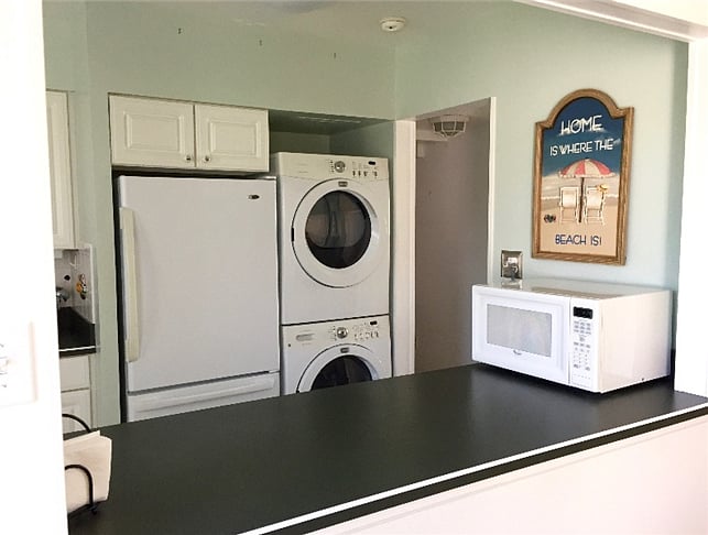 washer dryer stacked in kitchen corner
