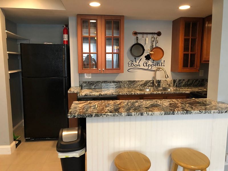 Kitchen with fridge, dishwasher, electric stove, microwave