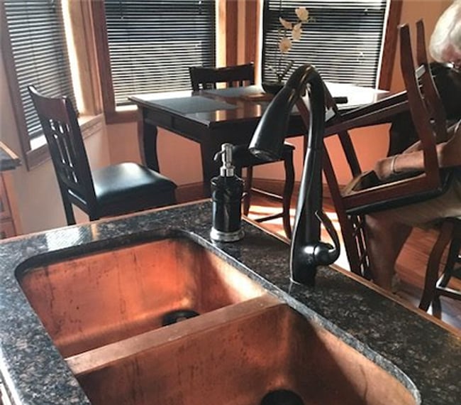kitchen with copper sink and granite countertops