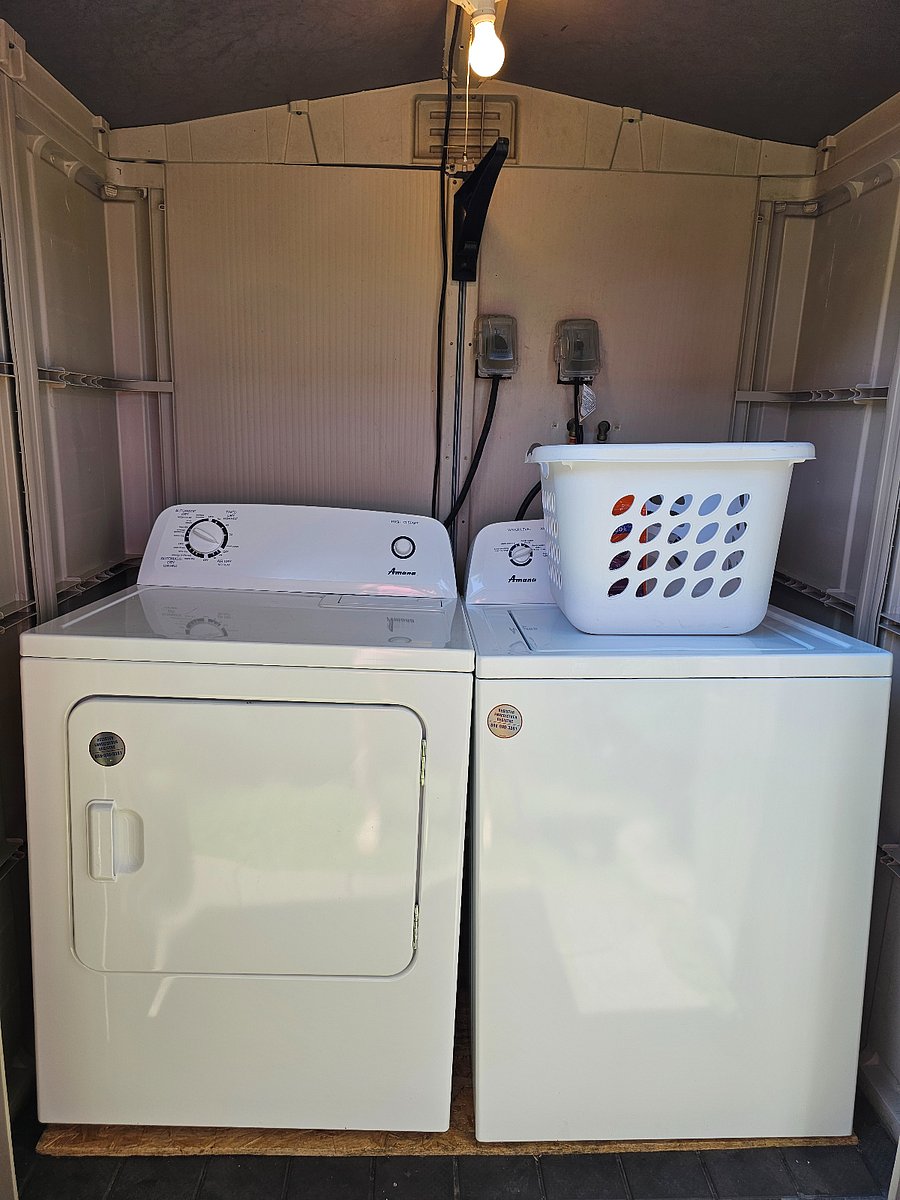 Washer and dryer that is right outside of your door in your own laundry shed.