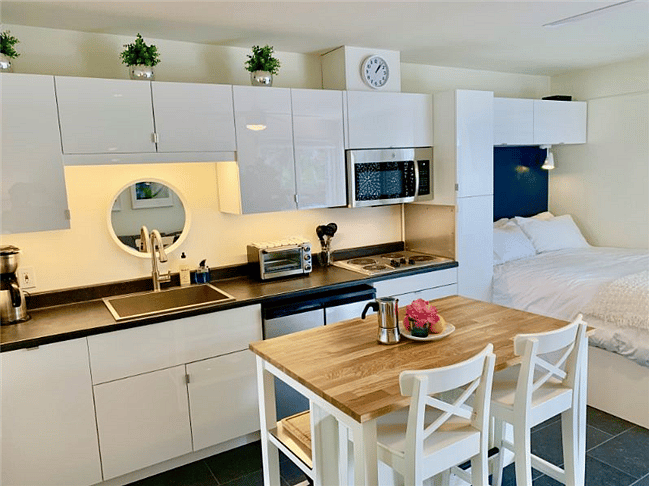 The kitchen is glossy and has everything you need.