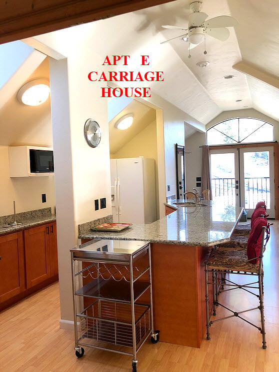 Spacious  Kitchen  Features a Huge granite counter for meal prep and dining Complete with comfortable Chairs . Well stocked for the Chef