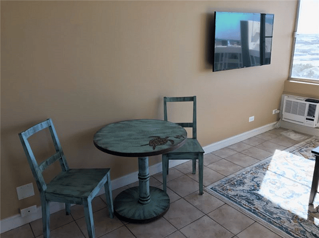 Across from sofa, 48" mounted TV