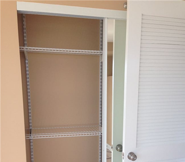 Mirrored closet behind bedroom door