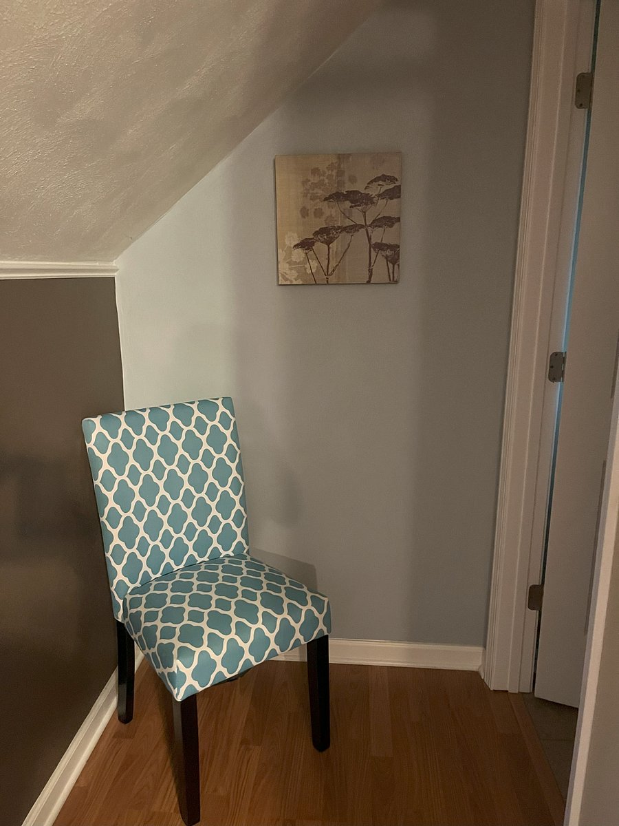 Orienting chair. The bathroom door is on the right.