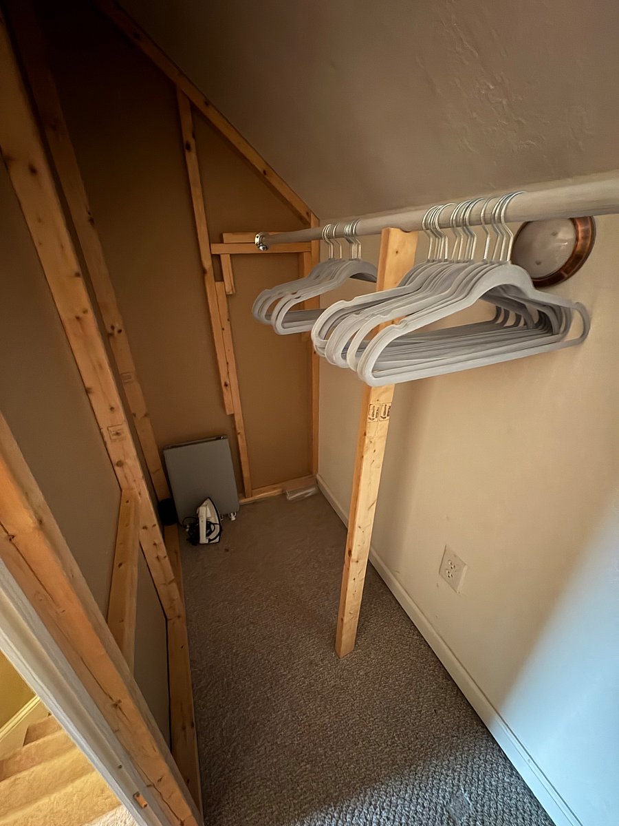Other side of the closet. Hangers are a bit low, but high enough for most shirts, pants and short coats.