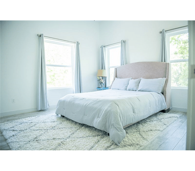 Windows all around in addition to light walls provide a bright and peaceful feeling throughout the house.