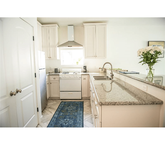 Fully furnished kitchen with pots, pans, dishes, silverware, and cups. Gas stove and oven to evenly and quickly prepare food.