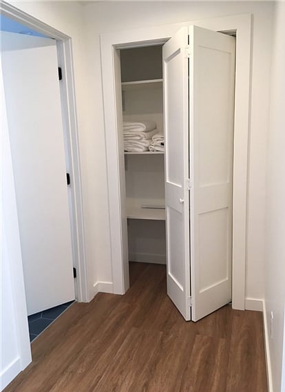 Hall closet with tenant storage