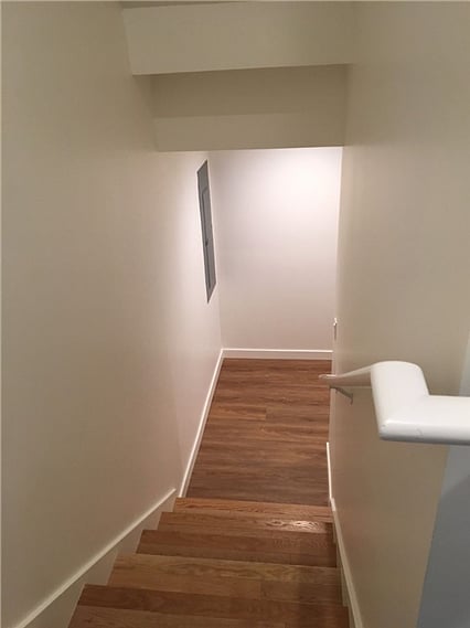 Interior stairs down to private unit