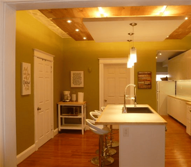 The kitchen features a lovely center island, full stove/oven, microwave, dishwasher, large refrigerator, and coffee maker