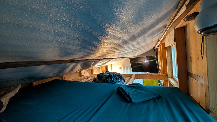 55" TV view from bed in the loft