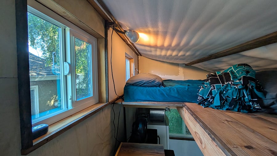 Loft north windows and bed