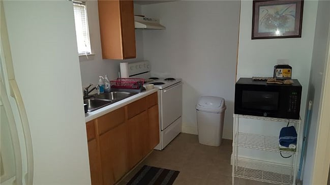 Kitchen with full size refrigerator/freezer; microwave; Keurig; electric range/oven