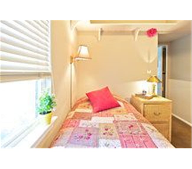 This is the Maid's Room. It's larger than this lens infers, but cozy.
Today the decor is greys and whites, very comforting.