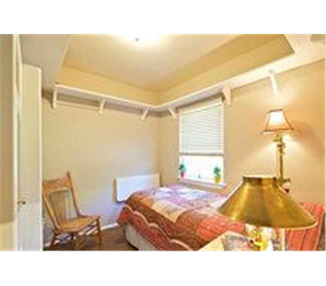 You have a fold-up desk at the foot of your bed and now a TV and dressing mirror on the blank wall, not shown.
Alsonotice the bookshelf along the ceiling...good to keep your less used items cleared from your floor area.