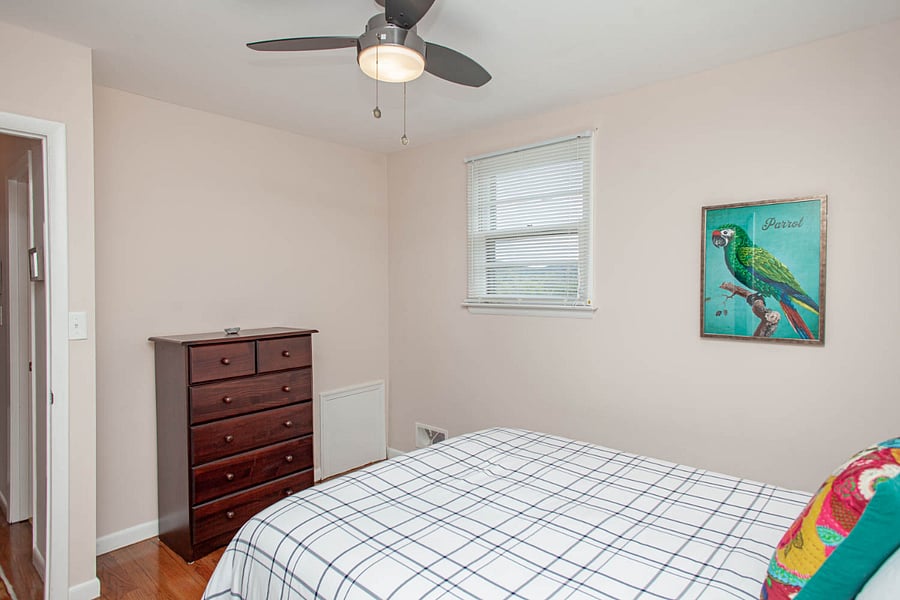 B: Bedroom two with one large closet and mountain views.