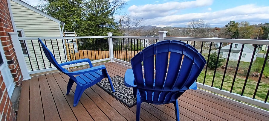 Private deck overlooks back yard and mountain view