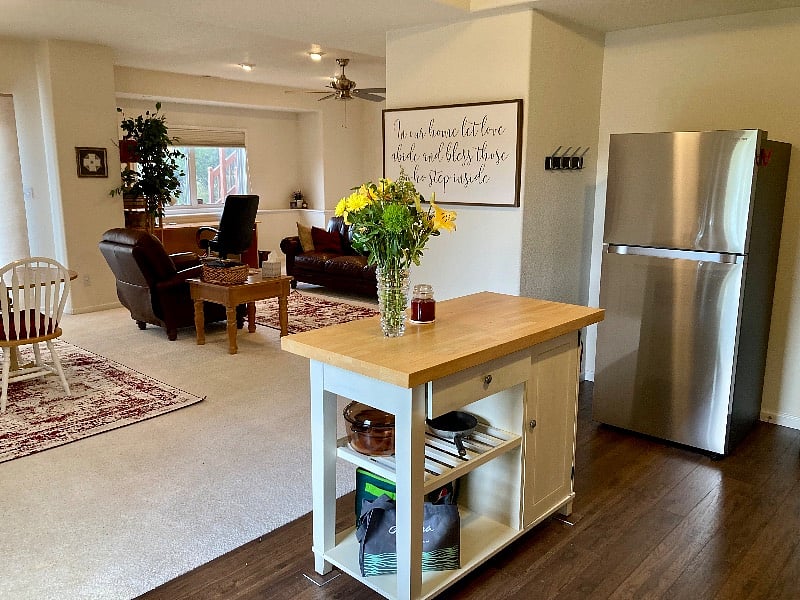 Kitchen with full size fridge and butcher block island