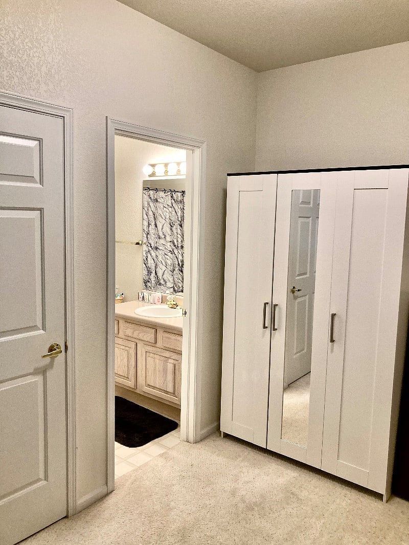 Closet and entry to bathroom