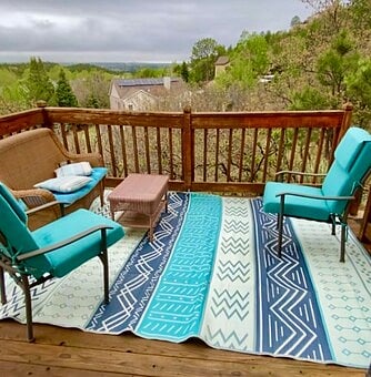 Updated deck furnishings overlooking the city