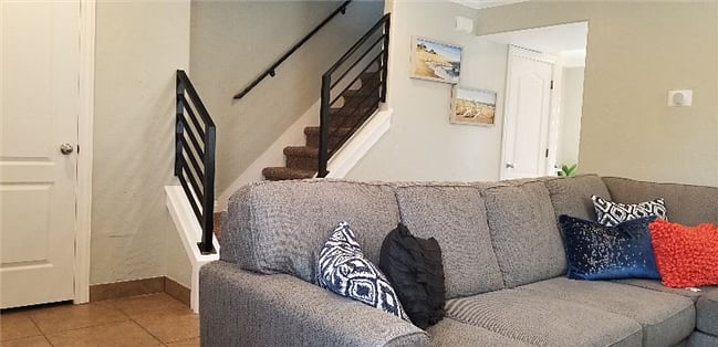 Living room with plenty of seating, fireplace and 50" tv