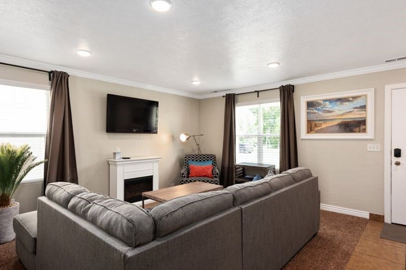 Living room with fireplace and 50" TV
