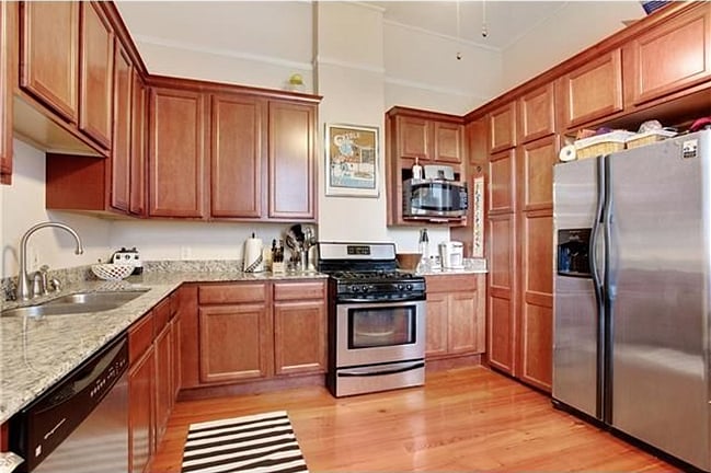 COMPLETELY FUNISHED KITCHEN WITH GAS STOVE AND FULL SIZE INSIDE WASHER & DRYER