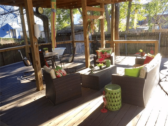 Covered and tree shaded back yard deck/patio.
