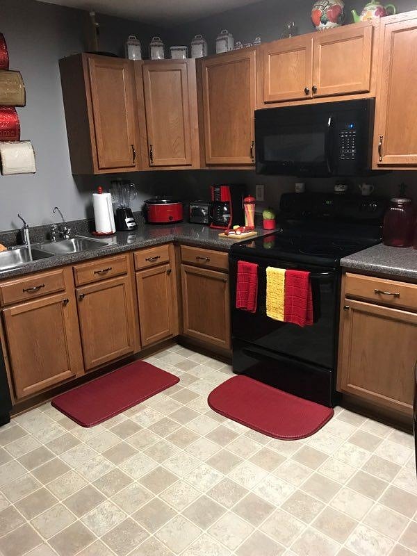 kitchen with full refrigerator, dish washer, stove