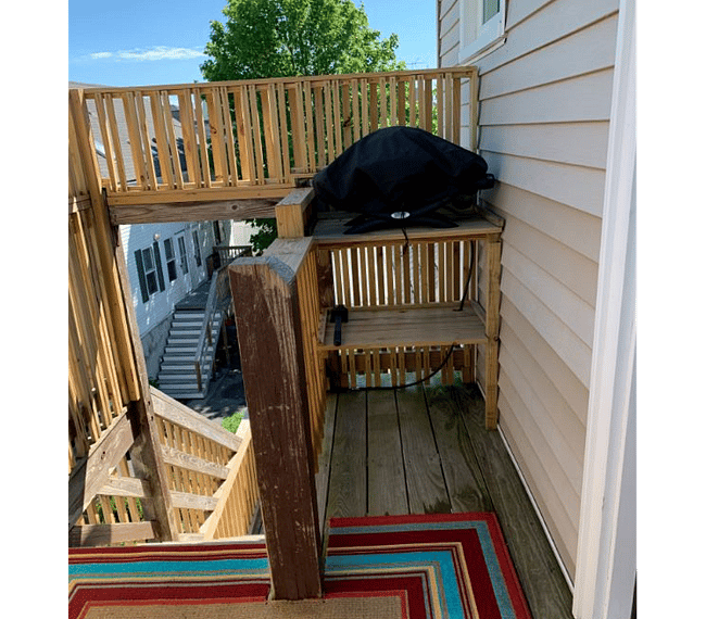 Deck with grill, chairs & table