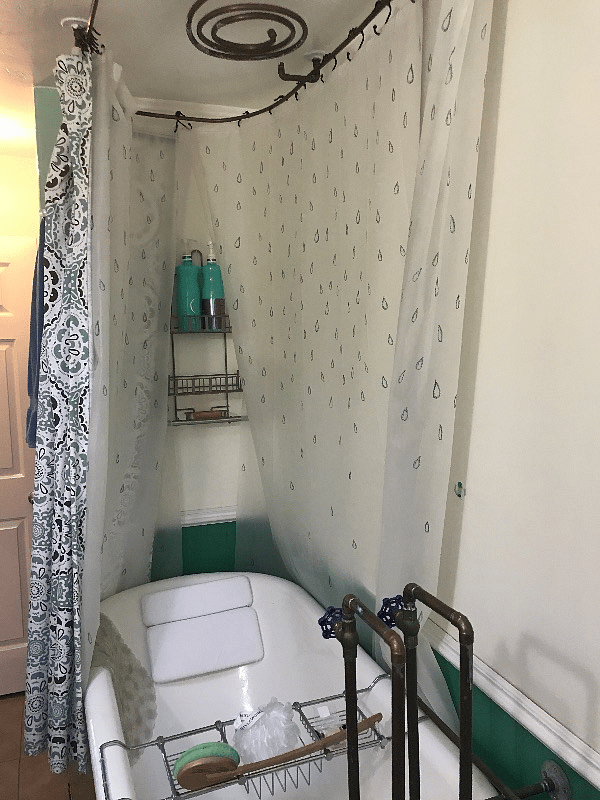 Claw tub with overhead custom rain head shower