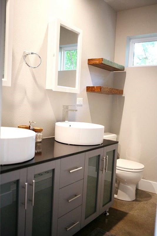 Enjoy maximized storage & counter space with this double vanity. Also, to the left of the shower are additional shelves! A small bathroom never felt so spacious!