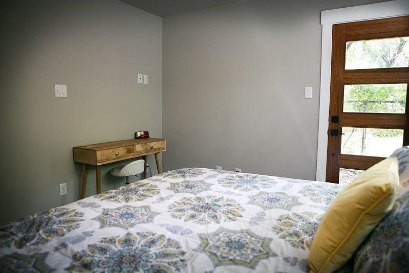 Each room includes a desk. Both rooms have the same comforter.