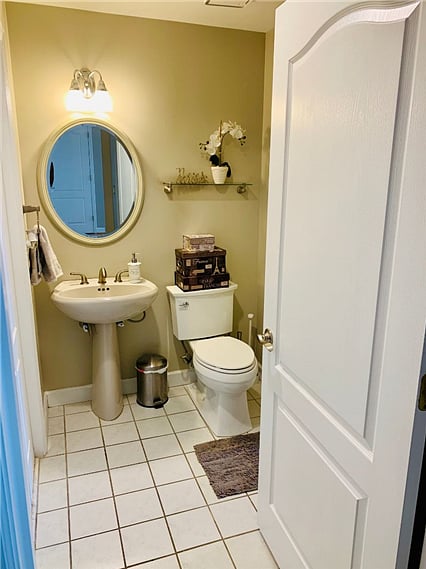 Bathroom with a full-sized washer and dryer.