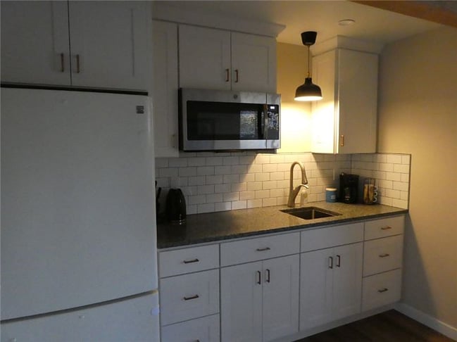 Kitchen includes a convection microwave and induction hotplate.
