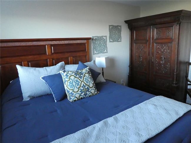 Queen Bed and wardrobe. Closet not in view.
