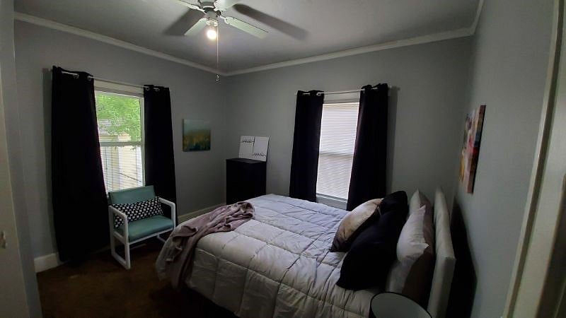 This is another view of the private bedroom. There are blinds with the curtains to help darken the room.