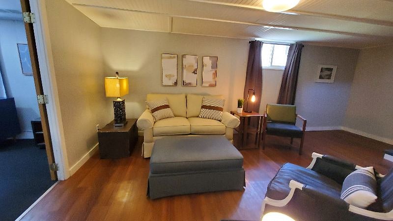The living area includes a window for plenty of natural light.
