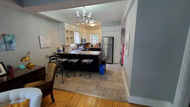 Here's where you transition from the living area to the kitchen. There is a desk provided for your use.