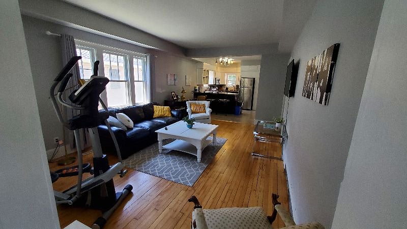 This is the view as you proceed into the home from the entry nook. You're welcome to use the eliptical if you desire!