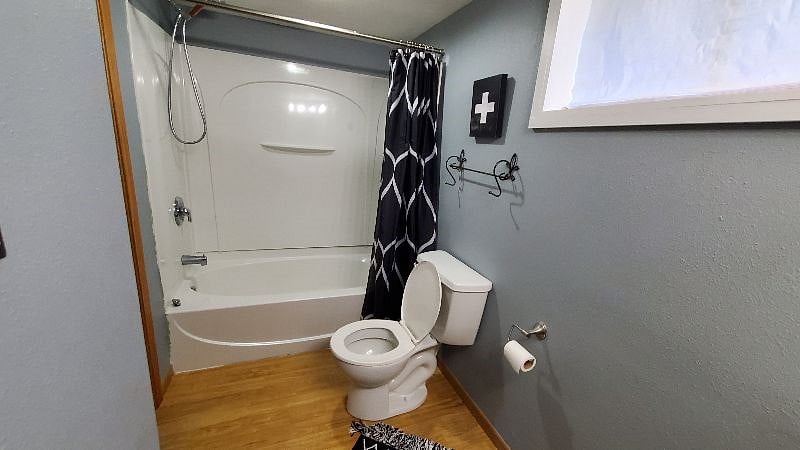 The bath has a full bathtub/shower.
