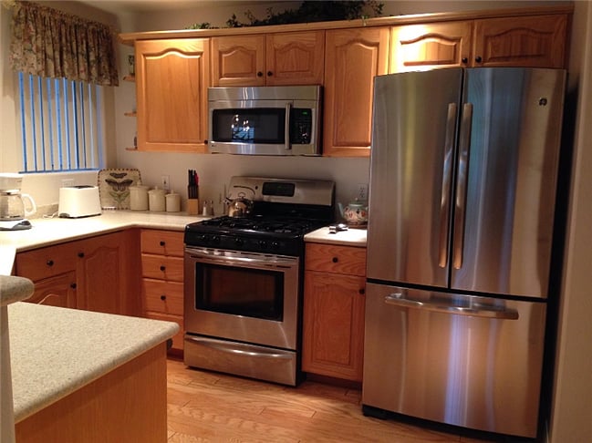 Kitchen with New Stainless Steel French Door Refrigerator