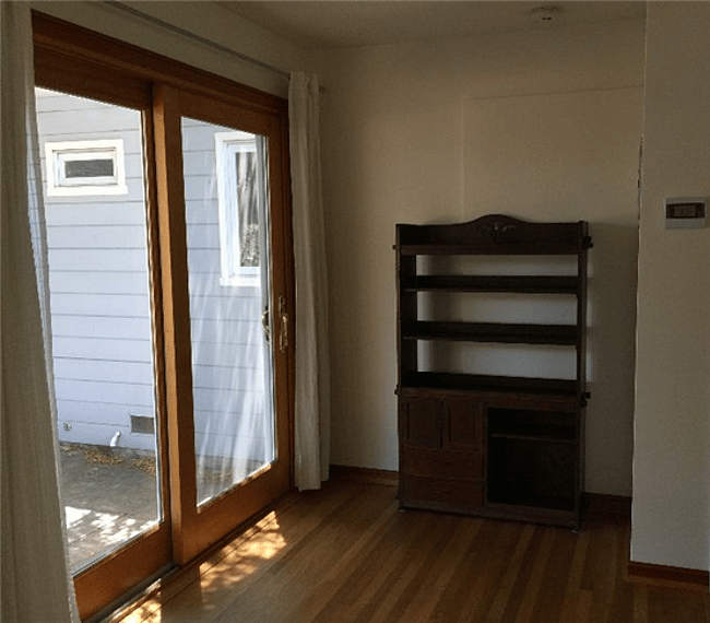 Bookcase opposite emergency exit for books and materials