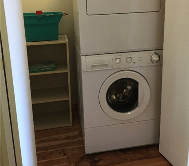 Whirlpool stackable washer-dryer for the studio located in the closet on the way to the bathroom.